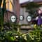 Glitzhome® 24" Halloween Metal Sunflower Skulls Glow-in-Dark Yard Stakes, 3ct.